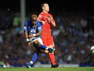 01 October 2011 Everton v Liverpool Collection: Intense Rivalry: Charlie Adam's Last-Ditch Defensive Stand Against Louis Saha's Goal Attempt