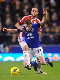 Images Dated 4th December 2011: Intense Rivalry: Coleman vs. Wilson - Everton vs. Stoke City