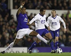 Images Dated 9th March 2011: Intense Rivalry: Distin vs Beausejour at Goodison Park - Everton vs Birmingham City