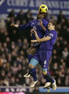 Intense Rivalry: Distin vs Jagielka's Battle for the Ball - Everton vs Stoke City, Barclays Premier League (01.01.2011)
