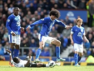 Images Dated 27th April 2013: Intense Rivalry: Fellaini vs. Enoh at Goodison Park - Everton's Narrow 1-0 Victory over Fulham