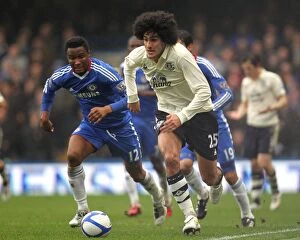 Images Dated 19th February 2011: Intense Rivalry: Fellaini vs Mikel in the FA Cup Fourth Round Replay - Chelsea vs Everton