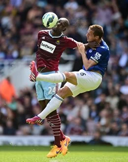 Images Dated 16th May 2015: Intense Rivalry on the Field: Jagielka vs. Cole - West Ham United vs. Everton, Premier League