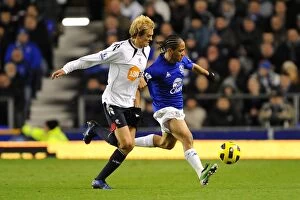 Images Dated 10th November 2010: Intense Rivalry on the Field: Pienaar vs. Holden - Everton vs. Bolton Wanderers: Battle for the Ball