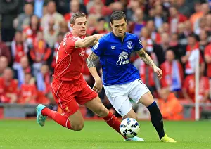 Intense Rivalry: Henderson vs. Besic - Liverpool vs. Everton, Premier League Showdown