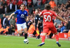 Images Dated 27th September 2014: Intense Rivalry: Leighton Baines vs. Lazar Markovic - Liverpool vs. Everton Clash at Anfield