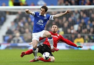 Images Dated 15th March 2014: Intense Rivalry: Leighton Baines vs Jordon Mutch - Everton vs Cardiff City