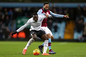 Aston Villa V Everton - Villa Park Prints: Intense Rivalry: Lukaku vs. Lescott's Battle for Ball Possession - Aston Villa vs