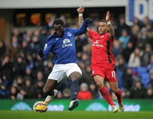 Everton v Leicester City - Goodison Park Collection: Intense Rivalry: Lukaku vs. Simpson's Battle for Ball Possession at Goodison Park