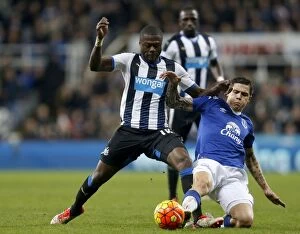 Newcastle United v Everton - Barclays Premier League - St James' Park Collection: Intense Rivalry: Mbemba vs. Besic's Battle for Ball in Newcastle United vs