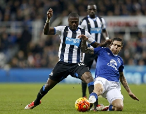 Intense Rivalry: Mbemba vs. Besic's Battle for Ball in Newcastle United vs. Everton Premier League Clash
