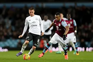 Aston Villa V Everton - Villa Park Prints: Intense Rivalry: McCarthy vs Ayew - Battle for Ball Possession