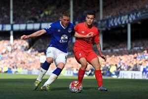 Images Dated 4th October 2015: Intense Rivalry: McCarthy vs. Coutinho - Everton vs. Liverpool Soccer Showdown