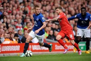 Liverpool v Everton - Anfield Collection: Intense Rivalry: McCarthy vs Moreno in the Merseyside Derby - Liverpool vs Everton