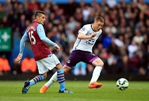 Aston Villa v Everton - Villa Park Collection: Intense Rivalry: McCarthy vs. Westwood's Battle for Ball Possession - Aston Villa vs