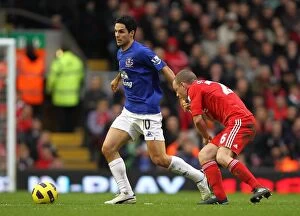 Images Dated 16th January 2011: Intense Rivalry: Mikel Arteta vs. Jay Spearing - Liverpool vs
