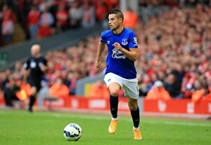 Images Dated 27th September 2014: Intense Rivalry: Mirallas in Action - Liverpool vs Everton, Premier League, Anfield