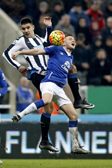 Intense Rivalry: Mitrovic vs. Cleverley Battle for Ball in Newcastle United vs. Everton Premier League Clash