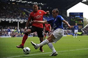 Images Dated 16th April 2011: Intense Rivalry: Osman vs. Jones - A Battle for Ball Possession, Everton vs