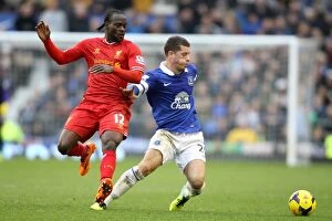 Everton 3 v Liverpool 3 : Goodison Park : 23-11-2013 Collection: Intense Rivalry: Ross Barkley vs. Victor Moses - Everton vs. Liverpool's Thrilling 3-3 Battle for