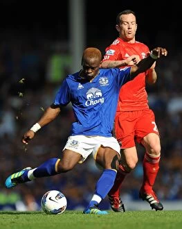 01 October 2011 Everton v Liverpool Collection: Intense Rivalry: Saha vs. Adam - Everton vs. Liverpool (01.10.2011): A Battle for Supremacy