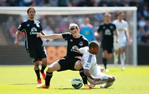 Framed Print : Intense Rivalry: Seamus Coleman vs Wayne Routledge - Swansea City vs Everton, Premier League: A Battle for the Ball Framed Print : Intense Rivalry: Seamus Coleman vs Wayne Routledge - Swansea City vs Everton, Premier League: A Battle for the Ball