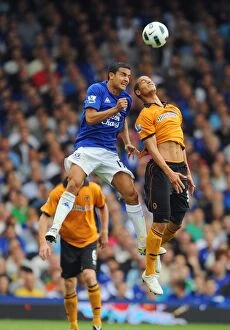 Images Dated 21st August 2010: Intense Rivalry: Tim Cahill vs. Adiene Guedioura - Everton vs