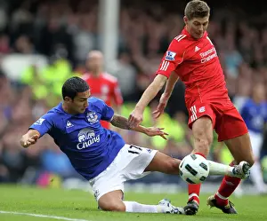 Intense Rivalry: Tim Cahill vs Steven Gerrard Battle for the Ball at Goodison Park