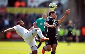 Images Dated 11th April 2015: Intense Rivalry: Williams vs. Pienaar - Swansea City vs. Everton