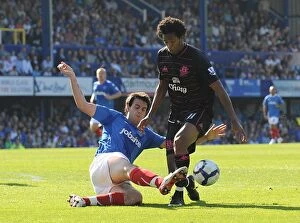 Portsmouth v Everton Collection: Intense Rivalry: Wilson vs. Alves - A Battle for the Ball in the Premier League