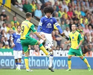 Norwich City 2 v Everton 2 : Carrow Road : 17-08-2013 Collection: Intense Tackle: Fellaini vs van Wolfswinkel - Everton vs Norwich City (BPL 2013)