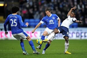 Images Dated 26th January 2013: Jagielka and Fellaini Stop Marvin Sordell: Everton's FA Cup Victory over Bolton Wanderers