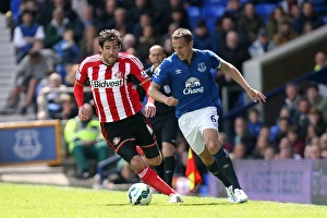 Everton V Sunderland - Goodison Park Prints: Jagielka vs. Graham: Intense Battle in Everton vs