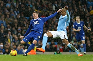 James McCarthy Faces Pressure from Fernando: Everton's Tense Shot in Capital One Cup Semi-Final at Etihad Stadium