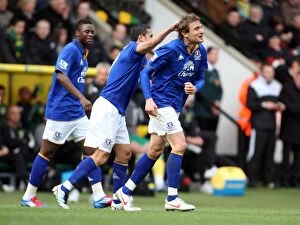 Images Dated 7th April 2012: Jelavic Scores the Opener: Tim Cahill's Emotional Congratulations at Carrow Road