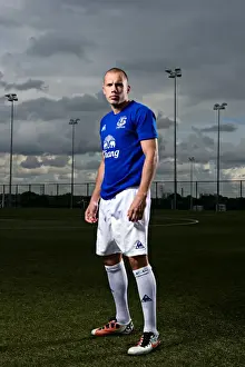 John Heitinga Prints: John Heitinga Unveils Everton's 2010/11 Home Kit: A First Look