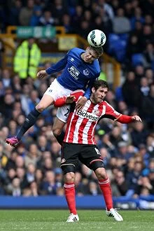 Images Dated 9th May 2015: John Stones vs Danny Graham: Aerial Battle in Everton vs Sunderland Premier League Clash at