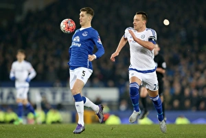 Emirates FA Cup - Everton V Chelsea - Quarter Final - Goodison Park Prints: John Terry vs. John Stones: A Battle for the Ball in the Emirates FA Cup Quarterfinal at Goodison Park