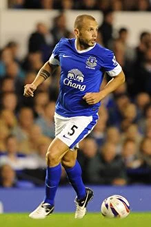 Images Dated 29th August 2012: Johnny Heitinga's Leadership: Everton's 5-0 Capital One Cup Thrashing of Leyton Orient (August 29)