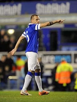 Images Dated 11th January 2014: Johnny Heitinga's Triumphant Moment: Everton's 2-0 Victory Over Norwich City (BPL, Goodison Park)