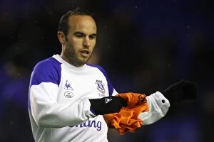 Images Dated 4th January 2012: Landon Donovan Stretching During Everton's Premier League Warm-Up vs