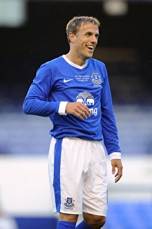 Pre Season Friendly - Everton V AEK Athens - Goodison Park Prints: Laughing Neville: A Light-Hearted Moment as Hibbert Takes a Pre-Season Shot (Everton vs AEK Athens)