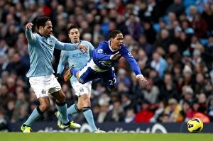 Images Dated 1st December 2012: Lecott vs. Pienaar: A Football Rivalry - Manchester City vs. Everton, Barclays Premier League (1-1)