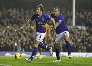 Images Dated 19th November 2011: Leighton Baines Penalty Goal and Celebration with Heitinga: Everton's Victory Moment vs