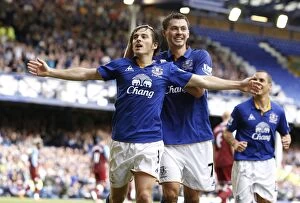 Images Dated 10th September 2011: Leighton Baines Scores and Celebrates with Bilyaletdinov: Everton's Penalty Goal vs Aston Villa