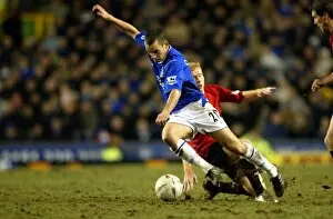Images Dated 27th May 2005: Leon Osman is fouled by Paul Scholes