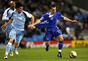 Manchester City v Everton Evertons Leon Osman and Manchester Citys Stephen Jordan