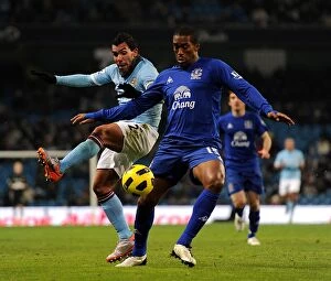 20 December 2010 Manchester City v Everton Collection: Manchester Derby Showdown: Distin vs Tevez - A Battle for Premier League Supremacy (Dec 2010)