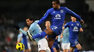 20 December 2010 Manchester City V Everton Prints: Manchester Derby Showdown: Distin vs Tevez - A Battle for Premier League Supremacy (December 2010)