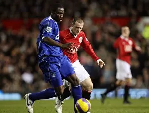 Manchester United v Everton Gallery: Manchester United v Everton Joseph Yobo Everton in action against Wayne Rooney